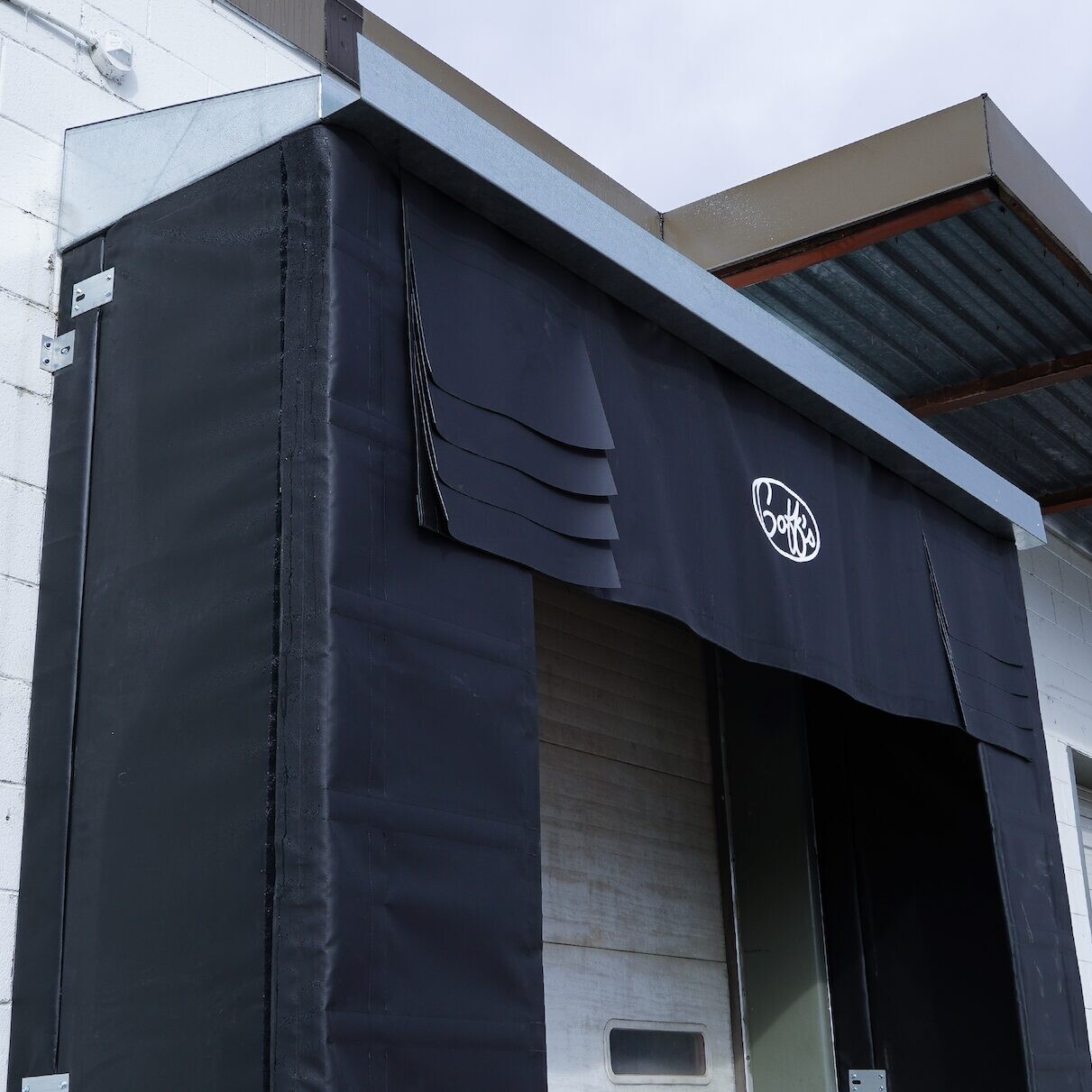 goffs-metalhood-shelter-install-metal-dock-hood